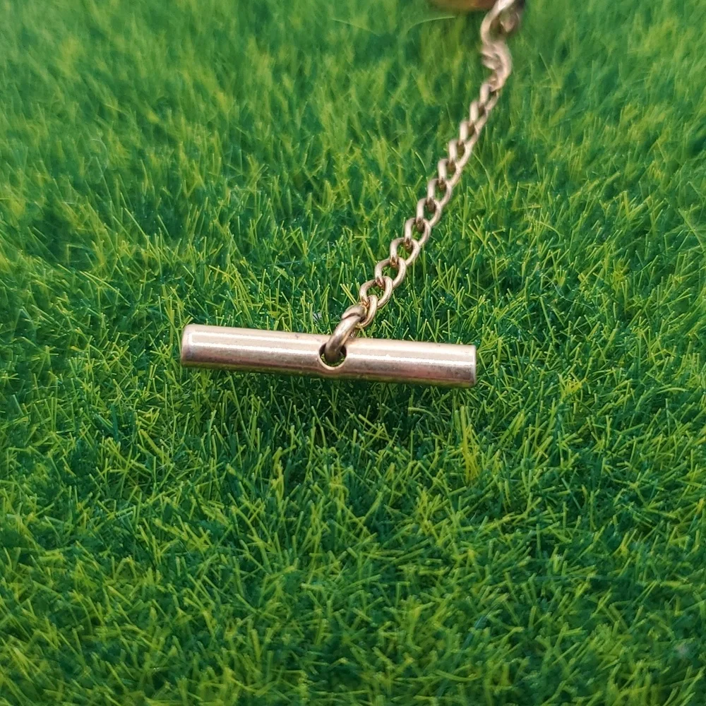 Gold Tone Tie Tack with Chain Overflow‎